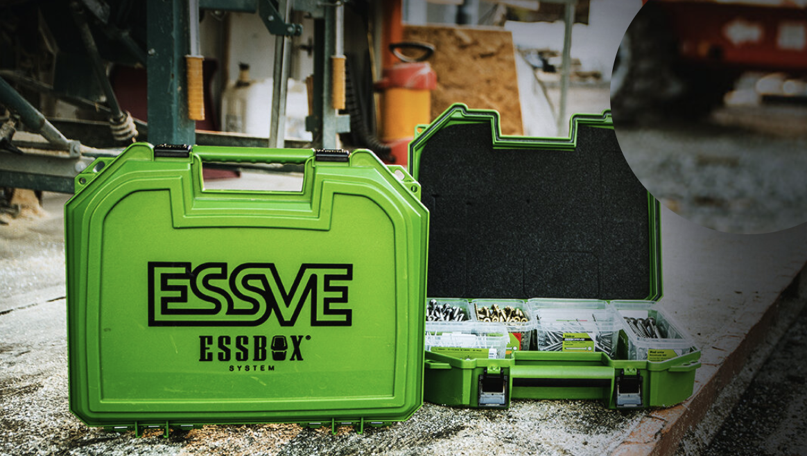 Open bright green ESSVE toolbox on a workshop floor with a secondary open case containing labeled fasteners and bits inside