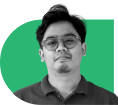 Portrait of a man wearing glasses and a dark polo shirt, facing the camera, with a green rounded background.