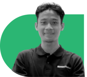 Young man in a dark polo shirt smiles, posing against a green curved backdrop.