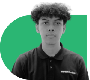 Portrait of a young person in a black polo shirt with a SPE Toolbox logo, against a green circular background.