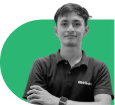 Portrait of a young man with arms crossed, wearing a dark polo shirt, standing in front of a green abstract background.